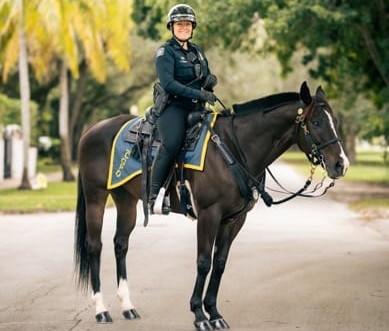 Rockaway and Coral Gables Police Officer Ashley Sheran posing on the streets in Coral Gables.