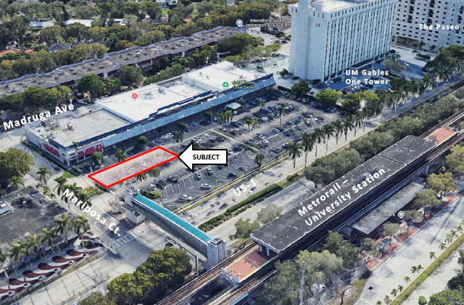 Aerial photograph of the 1250 South Dixie Highway site in Coral Gables, looking southeast. A red rectangle outlined in the center of the image marks the subject alley — a 45-foot wide strip of land running through a surface parking lot adjacent to the University Shopping Center on Madruga Avenue. A white arrow labeled "SUBJECT" points to the outlined area. US-1 runs diagonally through the lower portion of the image. The elevated Metrorail University Station platform is visible along the right side of the frame, with track running parallel to US-1. The UM Gables One Tower and The Paseo are visible in the upper right. Mariposa Court is labeled at lower left.Sonnet 4.6