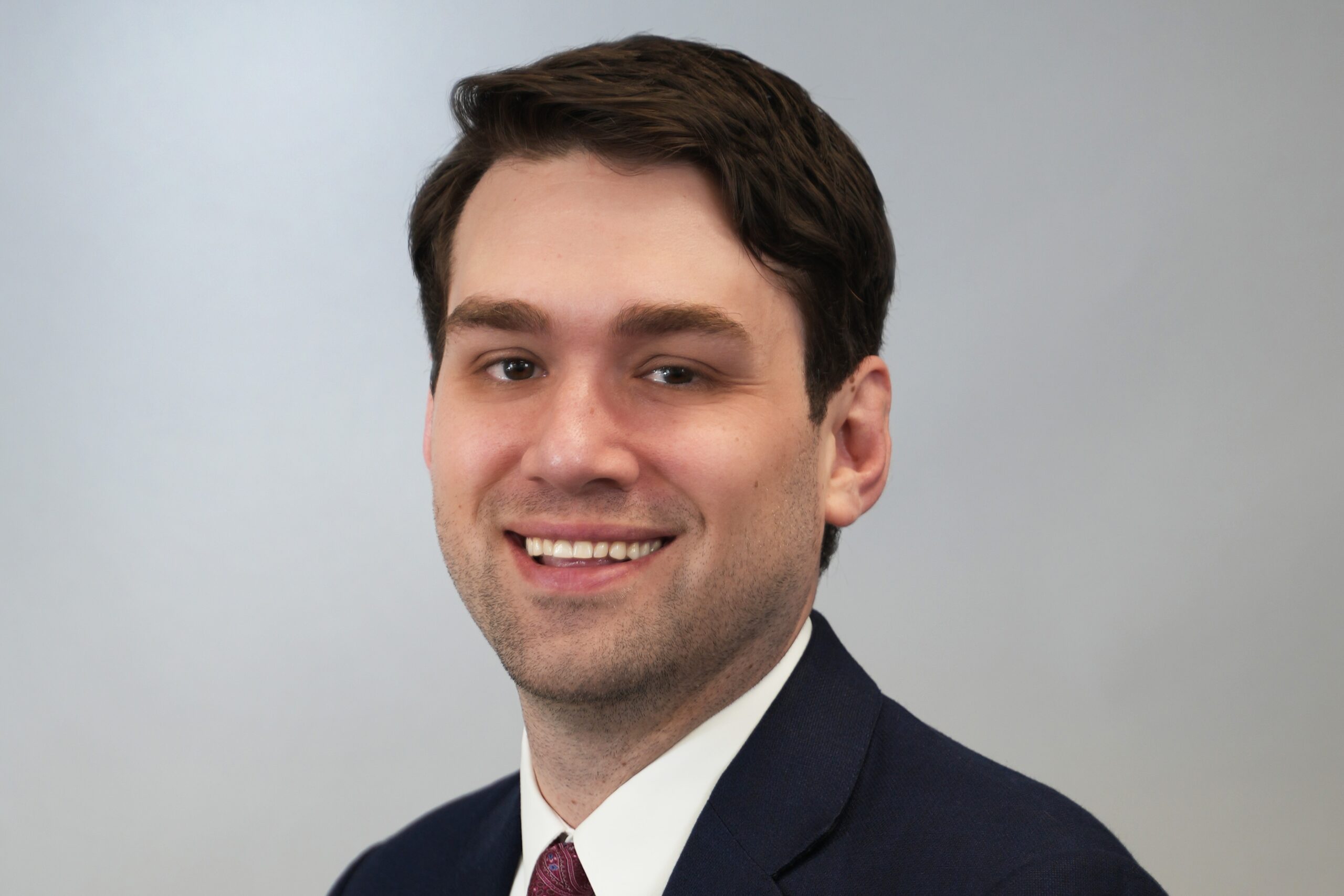 Headshot of Clifford R. Friedman, newly appointed director of human resources and risk management for the City of Coral Gables, wearing a suit and tie against a neutral background.