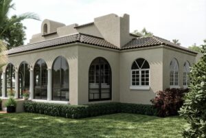 Architectural rendering of a Mediterranean-style Coral Gables home showing a proposed glass enclosure of an arched front porch with columns and tiled roof.