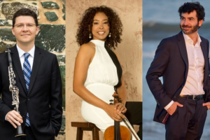 Three side-by-side professional headshots. At left, Alexander Fiterstein in a dark suit holding a clarinet against a stone wall backdrop. At center, Nokuthula Ngwenyama in a white dress holding a viola, seated against a warm neutral background. At right, Michael Stephen Brown in a dark blazer and open-collar shirt standing outdoors near the ocean.