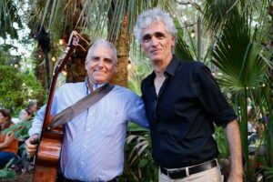 The duo of Dave Bricker (left) and Bruce Turkel will perform during June’s Gallery Night at the Coral Gables Museum, adding live American roots and acoustic music to an evening that also includes downtown gallery openings, fiber art, couture and community-focused exhibitions.