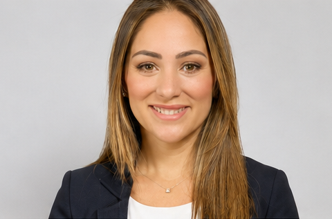 Head-and-shoulders portrait of Coral Gables Commissioner Melissa Castro wearing a dark blazer against a light gray background.