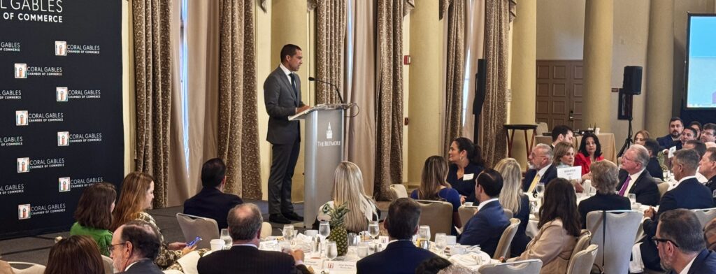 Mayor Vince Lago speaks from a podium at the Biltmore Hotel as attendees seated at banquet tables listen during the 2026 State of the City address.