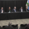 Seven Coral Gables and Miami-Dade officials sit at a long panel table during Mayor Vince Lago’s Sept. 23 Town Hall at the Public Safety Building.