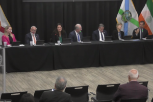 Seven Coral Gables and Miami-Dade officials sit at a long panel table during Mayor Vince Lago’s Sept. 23 Town Hall at the Public Safety Building.