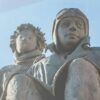 From New York to ‘The Little Prince’: lecture at Coral Gables Museum explores author’s American years Sculpture of Antoine de Saint-Exupéry seated beside the Little Prince against a pale blue sky.